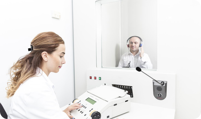 Technician performing hearing test