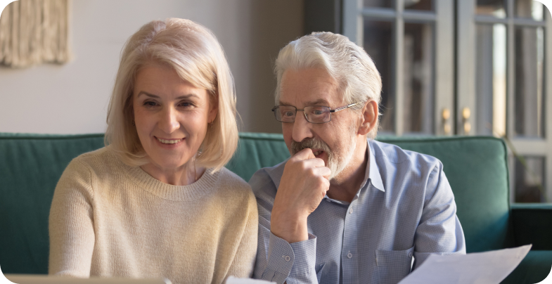 Couple looking at beltone hearing aid payment plans